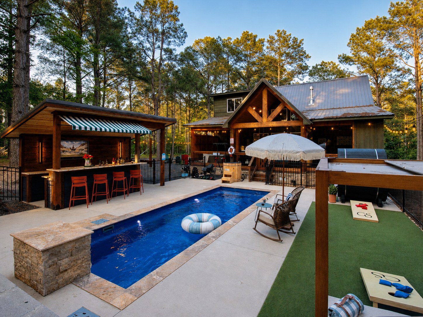 Gilded Spur backyard after Yellowwood Atelier design, second angle, Hochatown OK vacation rental: full outdoor resort program with pool deck, cedar-barrel sauna, hot tub, covered pool bar