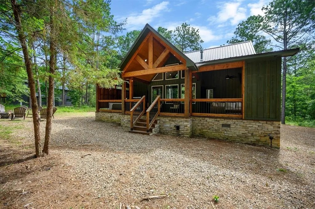 Gilded Spur cabin in Broken Bow OK before Yellowwood Atelier design, side angle of the original backyard footprint: bare grading, no pool, no outdoor amenities