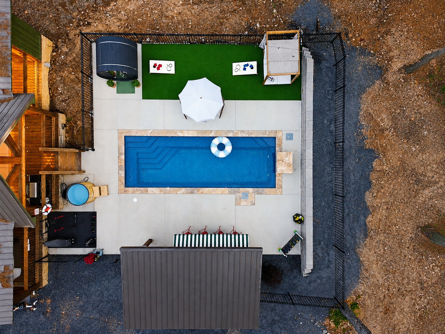 Aerial view of the resort-style pool and deck at Gilded Spur in Hochatown, Oklahoma