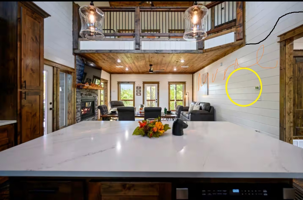 Generic Broken Bow cabin great room before — blank shiplap walls, default leather furniture, dark gray sectional