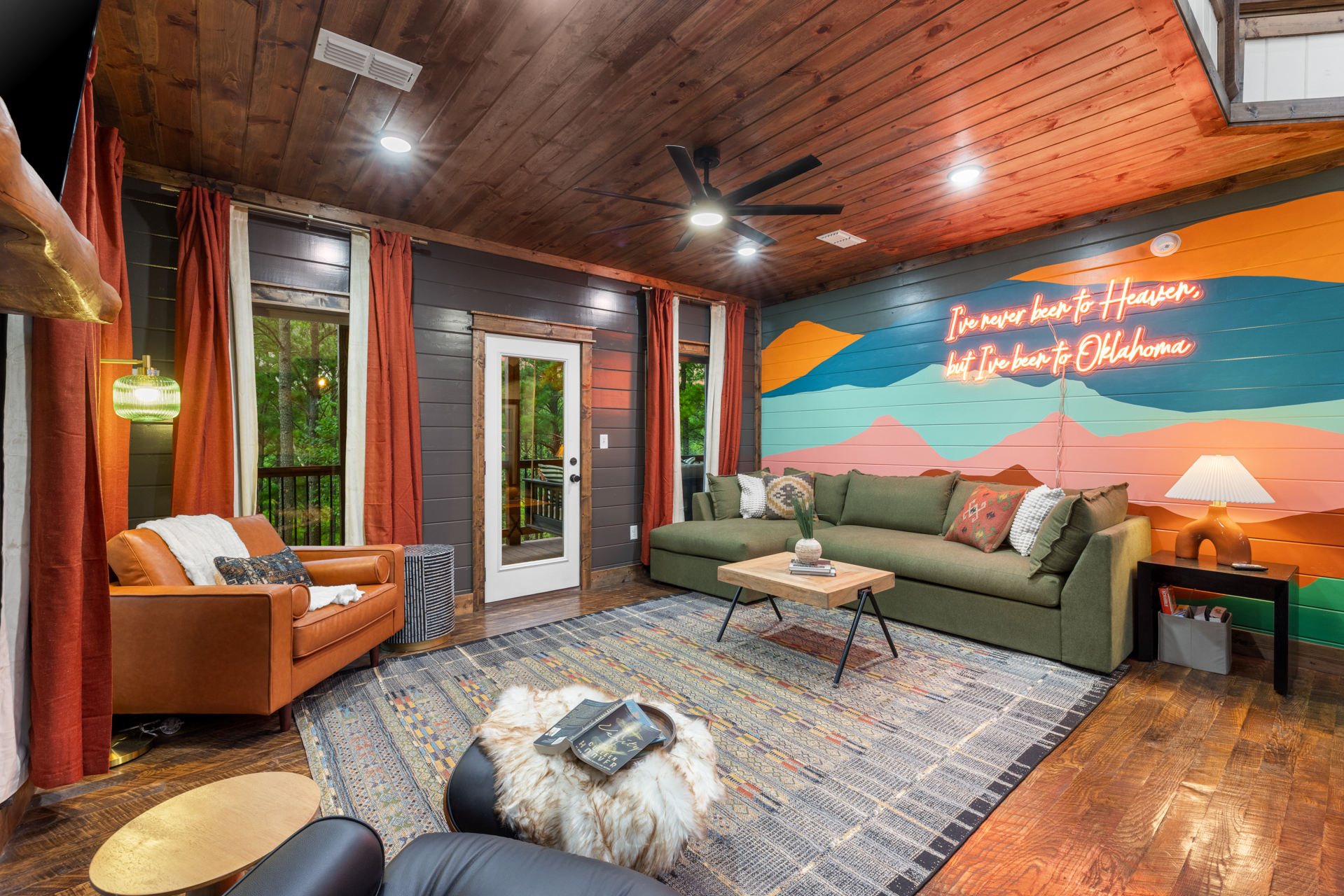 Lazy Lariat — great room with hand-painted Oklahoma mural and neon sign